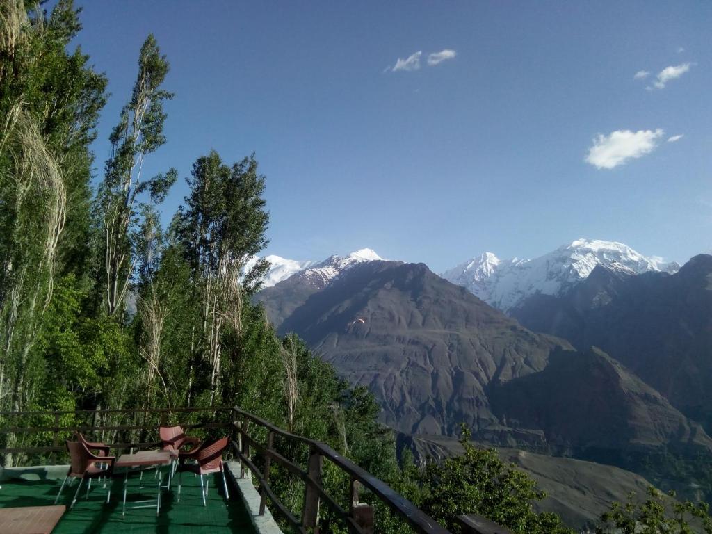 Panoramic view of Hunza Valley mountains at sunset with Rakaposhi peak visible